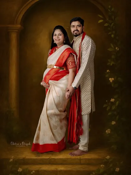 The elegance of tradition is timeless. We specialize in creating painterly, fine-art portraits that honor your cultural heritage, like this beautiful couple in classic Indian attire.