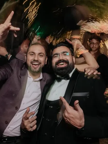 The groom and his friends having the time of their lives on the dance floor.