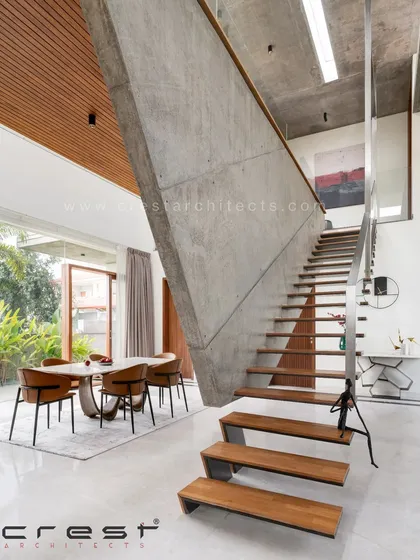 A closer view of the inimitable floating staircase, which is cantilevered from a suspended concrete wall. This gravity-defying feature is a testament to our focus on structural innovation and creating functional art.