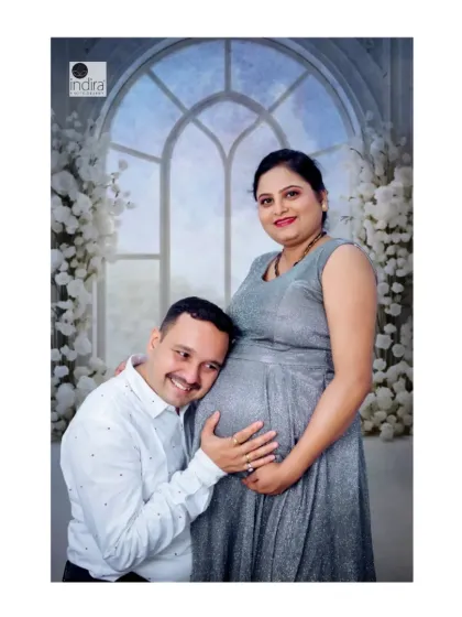 A classic maternity pose with the father-to-be listening to the baby bump, full of love and anticipation.