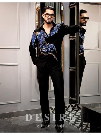 Another full-length view of the abstract wave shirt, a piece that speaks louder than words.