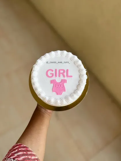 This is a fire cake, where a layer burns away to reveal the message underneath. This one revealed "GIRL" for a very special gender reveal party.