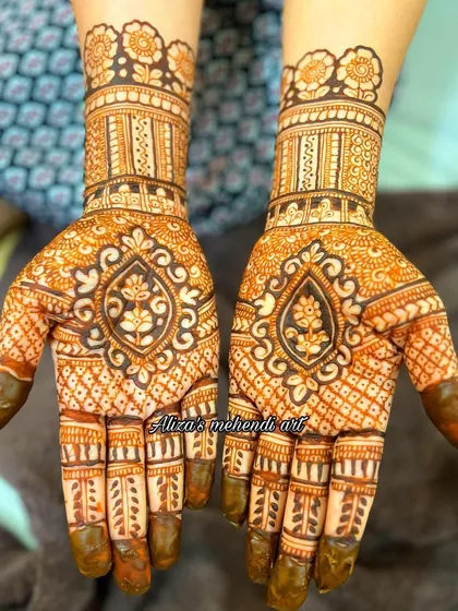 A designer hand with a central lotus motif and intricate patterns.