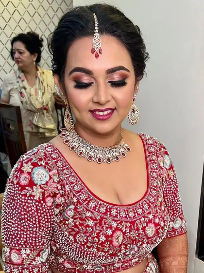 A close-up of the eye makeup, featuring a soft blend of pink and brown shadows with a touch of shimmer, creating a romantic and elegant look.