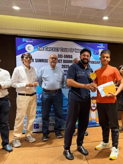 Vikrant Negi receiving his BS U15 Winner's trophy at the CCI GMBA Yonex Sunrise District Badminton Championship. His performance also secured him a place on the Greater Mumbai Badminton Team.