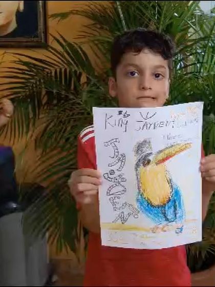 A still from the video, showing Jayden and his fantastic toucan drawing.