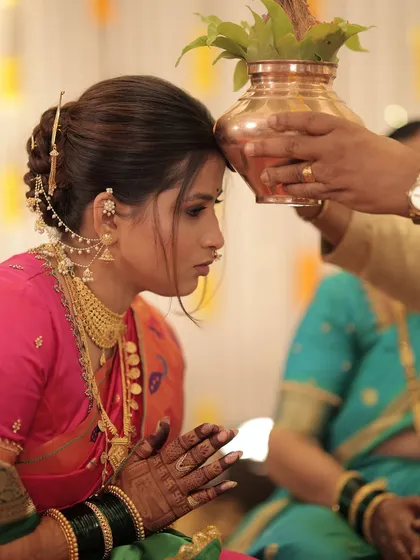 A sacred moment during the wedding rituals, with the bride looking serene and beautiful.