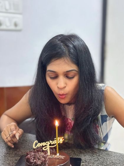 A candid moment of a birthday wish being made over our chocolate cake. We cherish being a part of your special moments.