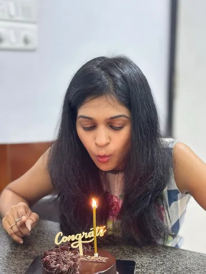 A candid moment of a birthday wish being made over our chocolate cake. We cherish being a part of your special moments.