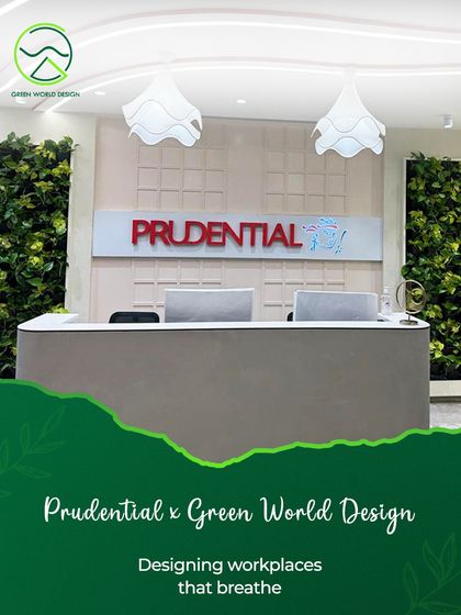 The reception at Prudential, designed to make a statement about the company's commitment to wellbeing. The vertical green walls flanking the entrance are not just decor; they are a living system that signals a healthy, modern, and people-centric corporate culture.