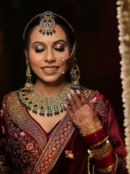The serene beauty of a bride in her element. The soft, shimmery eye makeup and glowing skin make her look absolutely ethereal.