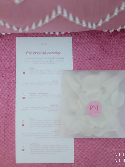 The wedding program for the 'Echoes of Pink' ceremony, explaining the seven sacred vows. These personalized details help guests connect more deeply with the celebration.
