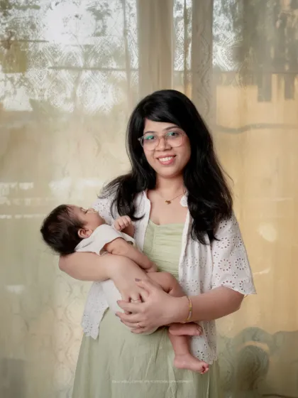 A mother's gentle smile says it all. I love capturing these bright, natural-light portraits that show the pure happiness of motherhood.