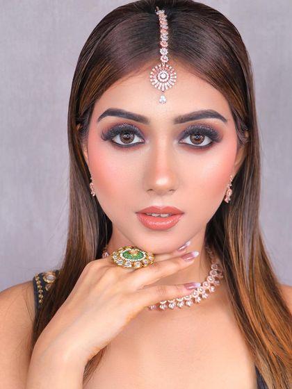 This glittery smokey eye, created by our student Reena, is perfect for a cocktail party or reception. We teach how to master glitter application for a high-impact look.