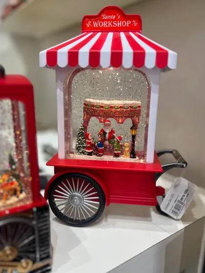 Santa's workshop has arrived in my store! This musical snow globe cart is a magical addition to your Christmas decor.