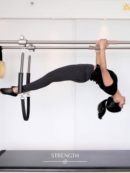 Conquering an advanced hanging exercise on the Cadillac. This move is a journey of strength, stability, and trusting your body's capabilities.