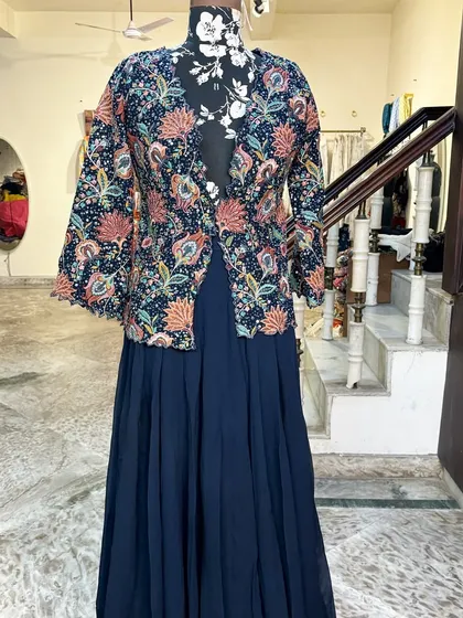 The full view of the jacket and skirt set. The flowy skirt is comfortable and stylish.