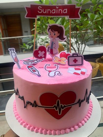 An interactive photo-pulling cake with a medical theme.