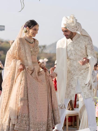 A playful moment on the mandap stage. It's important that the wedding day is not just formal but also fun, reflecting the couple's unique chemistry and joy.