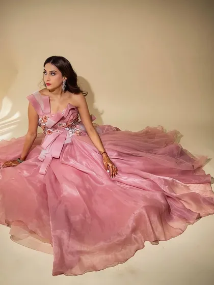 The full effect of this gorgeous pink gown and glamorous makeup. The look is soft yet dramatic, making it perfect for a memorable celebration.
