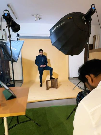 A look at our studio setup for a formalwear shoot, complete with a seamless paper background, lighting, and a tethered shooting station to review images instantly.