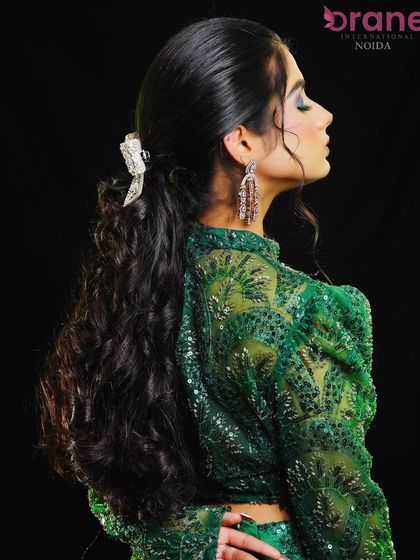A side profile view of the half-up hairstyle, showing its elegant structure.
