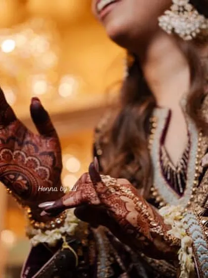 A candid shot of the bride, where you can see the beautiful dark stain on her hands. It makes me so happy to see my work looking this good on the wedding day.