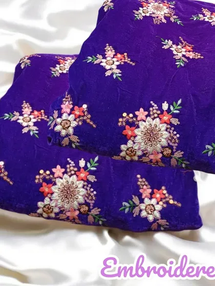 A beautiful royal blue velvet fabric with all-over floral embroidery, perfect for a luxurious blouse or kurta.