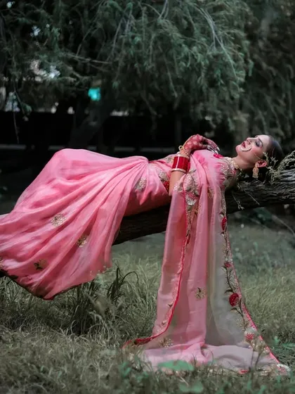 A joyful, relaxed pose on the tree branch, capturing a candid moment of laughter.