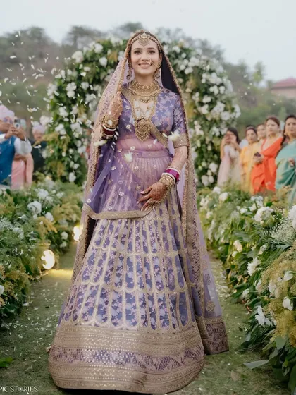 A bride's walk down the aisle is a story in itself. For Riti, in her stunning lavender lehenga, it was a moment of pure grace and happiness. My goal is to capture this elegance, creating timeless bridal portraits that feel like they belong in a magazine.