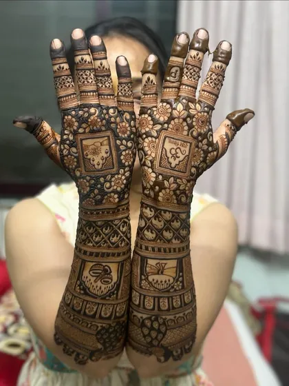 A beautiful design featuring symbolic motifs within square panels, covering the full length of the arms.