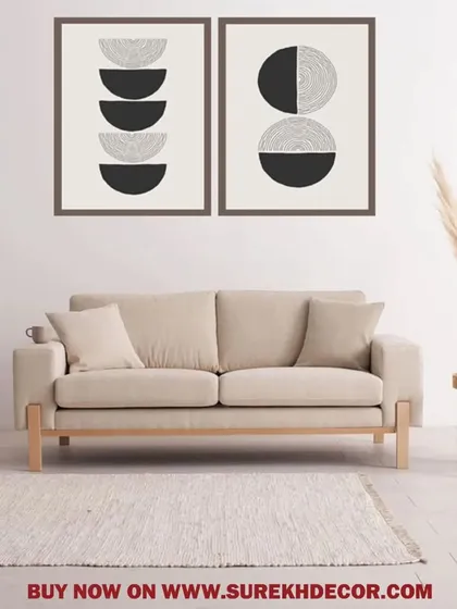 This set of two framed prints features abstract lunar-inspired designs in black and white. The stacked semi-circles create a modern, graphic look that is both simple and visually interesting.