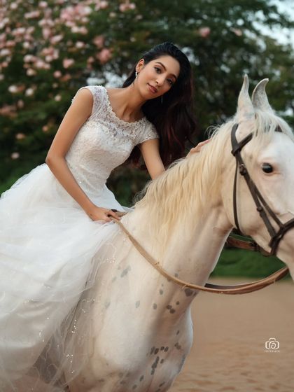 A closer shot of the model on the horse, creating a sense of connection and intimacy. This image showcases my ability to direct both human and animal subjects for a perfect portrait.