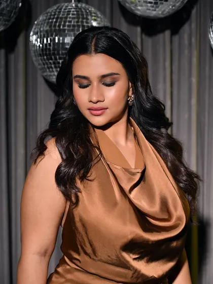 The soft-focus on this shot highlights the beautiful contour and highlight work, a key skill we teach for camera-ready makeup.