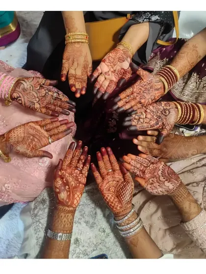 There's nothing like a henna party! This is a shot of a bride and her siders, all showing off the beautiful stains from their mehndi. I love creating designs for the whole bridal party.