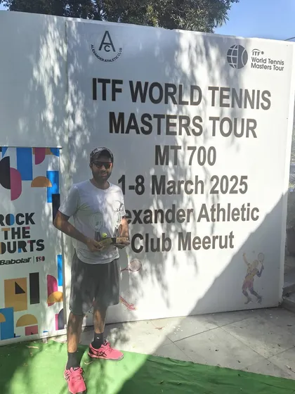 A solo shot with the winner's trophy. Each victory is a milestone in our professional playing career.