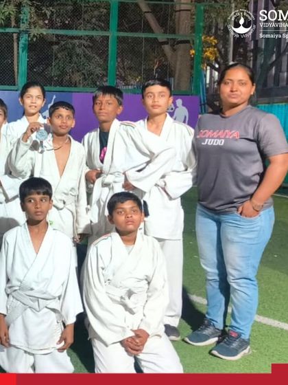 A team of our young male judo athletes with their coach after competing in the Inter School Judo Championship.