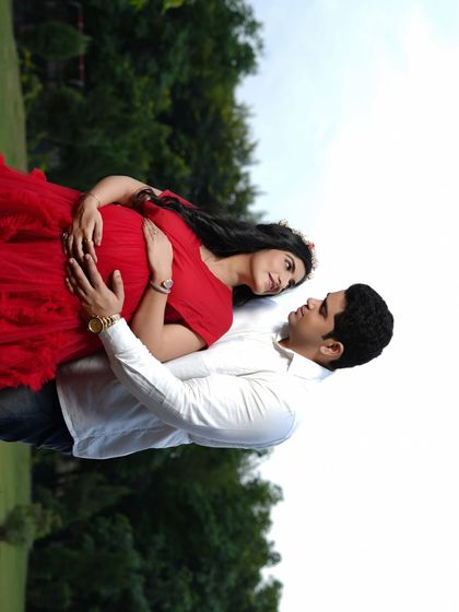 Lost in a moment, just the two of them. This intimate outdoor couple's portrait showcases the deep connection between partners, a perfect memory from their pregnancy journey.