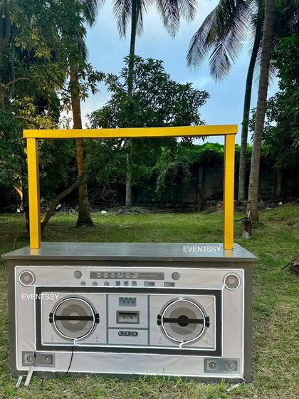 A fun and retro boombox-themed DJ booth or snack counter, perfect for a music or rockstar party.