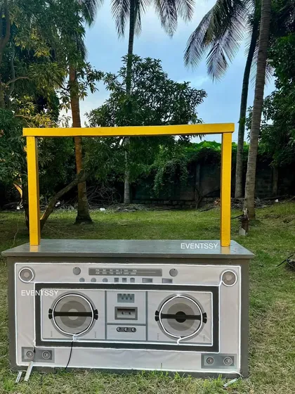 A fun and retro boombox-themed DJ booth or snack counter, perfect for a music or rockstar party.