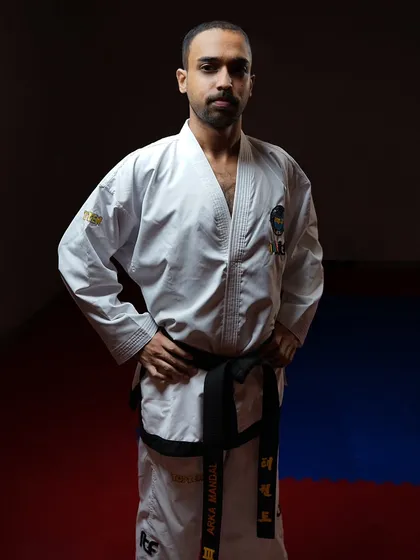 A powerful stance in my Taekwon-Do uniform. The goal is to be unstoppable, not through brute force, but through unwavering self-belief and the discipline to see things through.