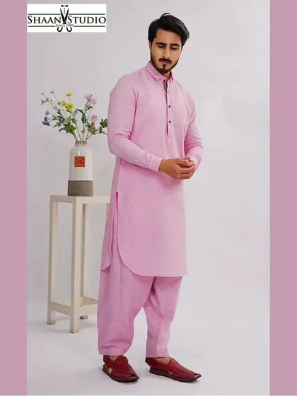 Our classic Pathani suit in a subtle pink, professionally modeled to show its clean lines and comfortable fit. This custom-made ethnic set is a versatile choice for festivals like Eid or other formal gatherings.