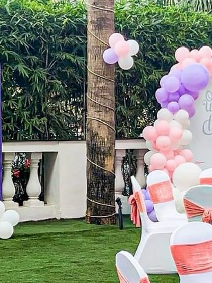 Another angle of the outdoor princess party, showing the coordination between the table settings and the themed backdrops. The pastel colors create a soft and dreamy atmosphere.