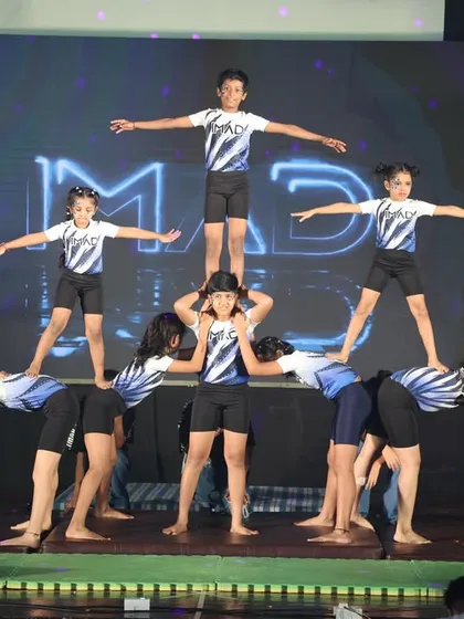 This is what teamwork looks like at IMAD. Our students learn to trust and support each other to create amazing human pyramids and group formations, building both physical strength and strong friendships.