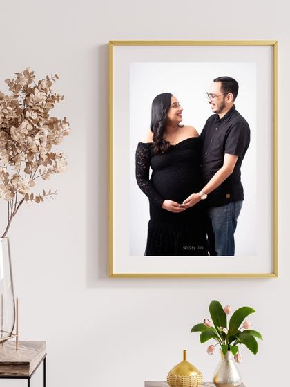 A beautiful framed portrait of a couple, showcasing how your maternity photos can become timeless art for your home.