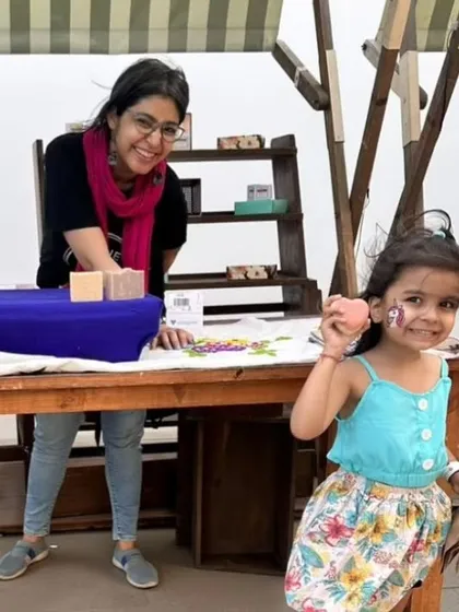 A young visitor at my stall at The Green Co-op, happily holding her new soap. Moments like these are priceless.