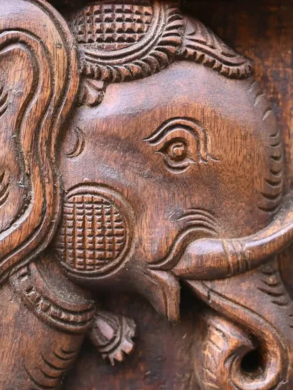 A detailed shot of the elephant figure at the base of the Ashta Ganesha panel. Even secondary elements are given the same level of care and intricate detail.