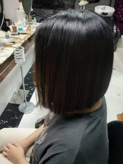 This angle shows how a classic bob sits neatly at the nape of the neck. It's a timeless style that exudes confidence.
