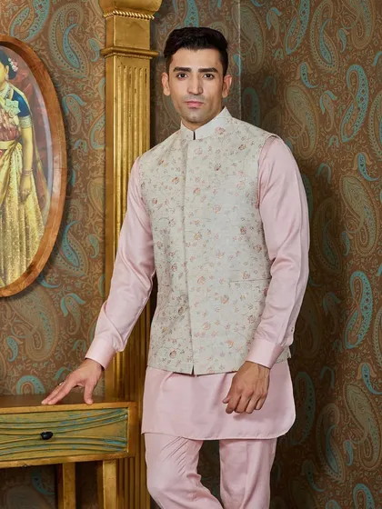A classic pose showing the full kurta and bundi set. This outfit is a testament to how pastels can be both festive and masculine.