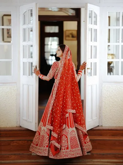 A bride's portrait is a story in itself. I take the time to capture the elegance and anticipation, focusing on the beautiful details of the wedding lehenga and the quiet moments before the ceremony begins.